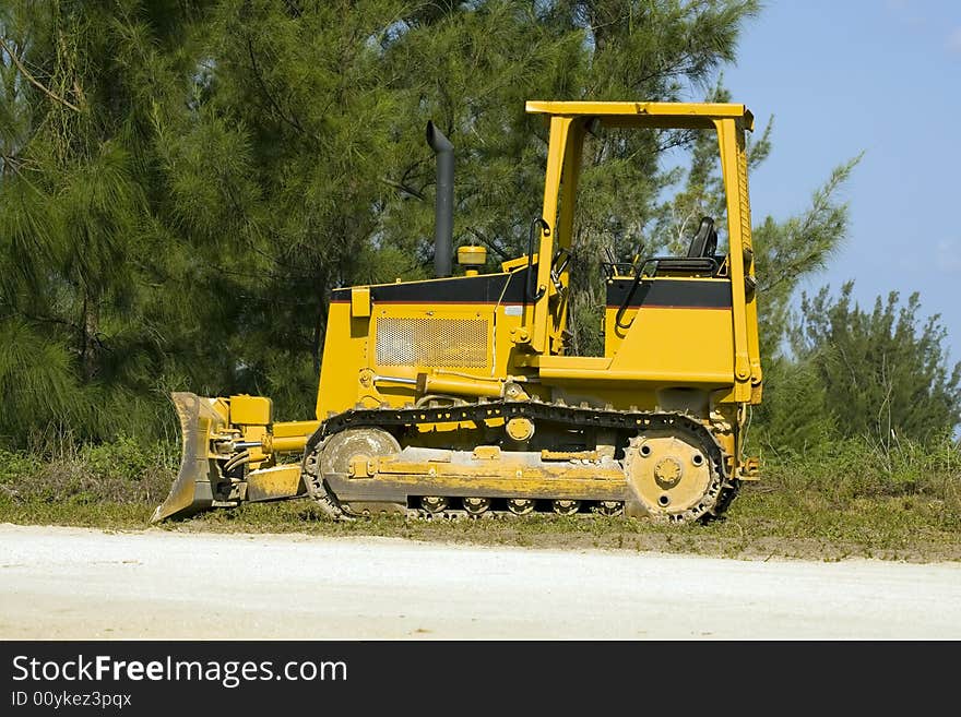 A small bulldozer sits idle