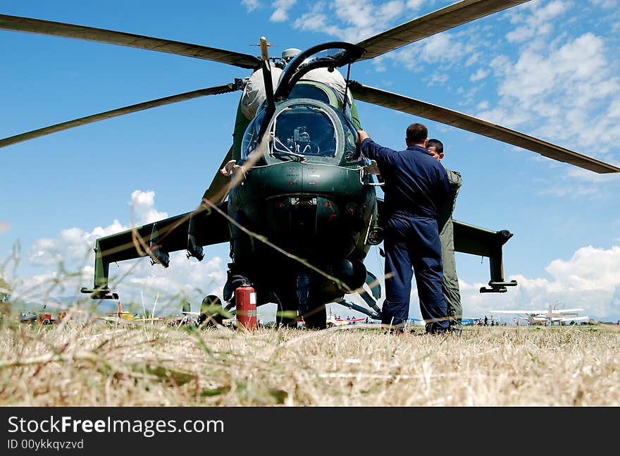 Military helicopter on the ground for maintinence. Military helicopter on the ground for maintinence