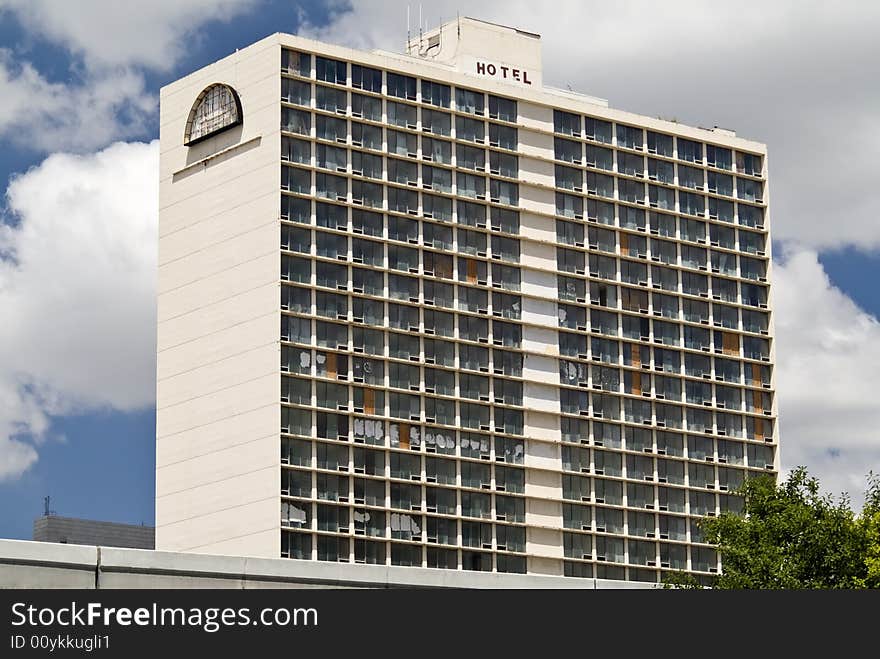 A large empty hotel building with evidence of vandalism and general abuse and neglect. A large empty hotel building with evidence of vandalism and general abuse and neglect.