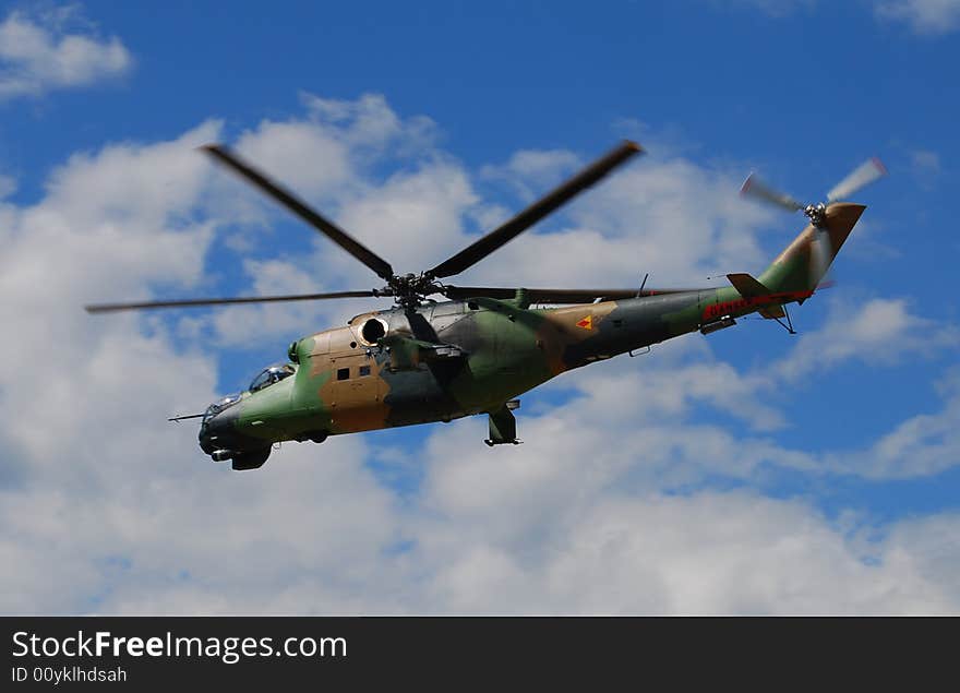 Military helicopter flying in the sky. Military helicopter flying in the sky