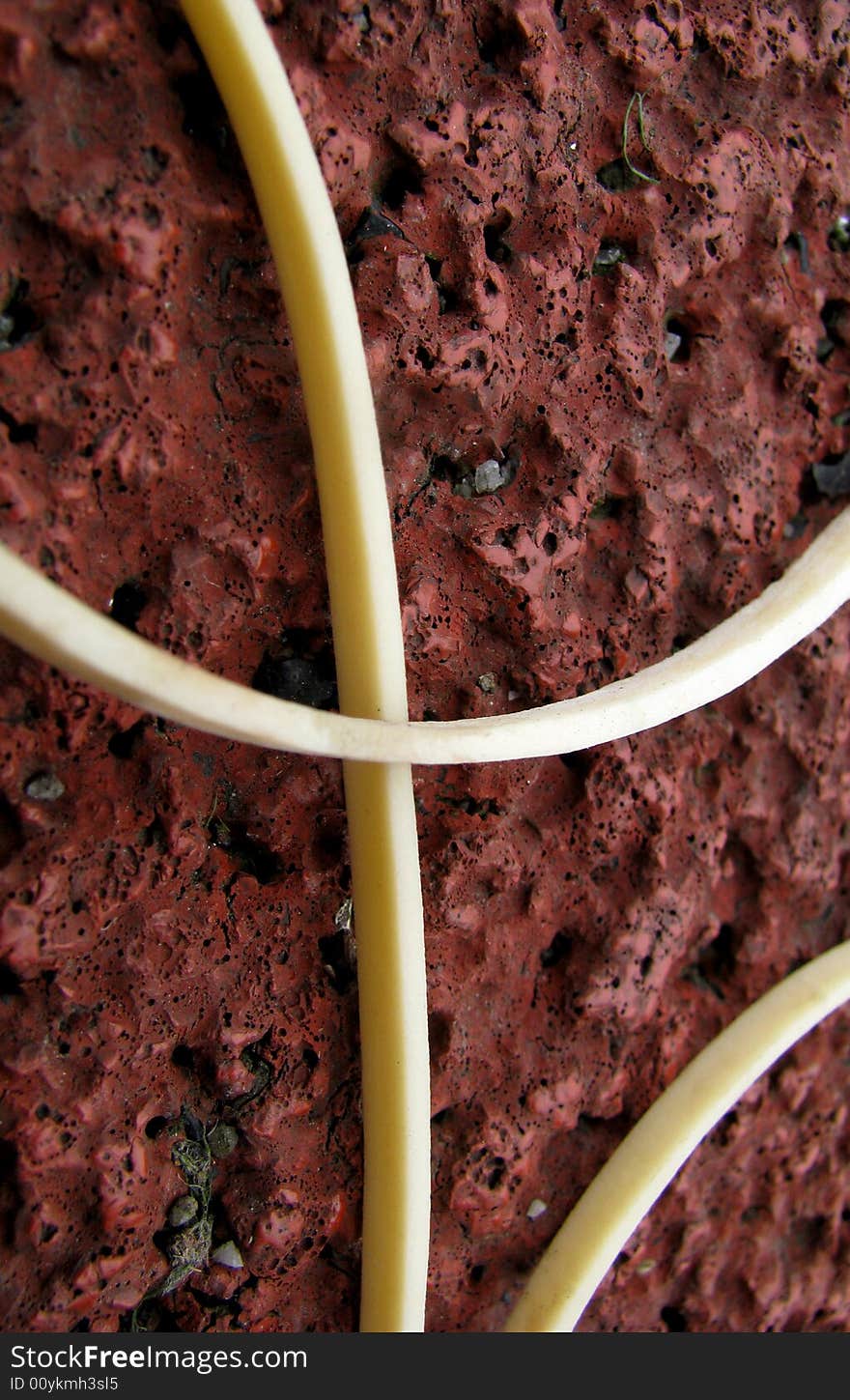 Close-up of white rubber line on red background