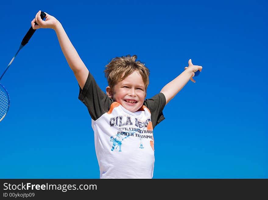 The blue sky. The cheerful boy is dared. The blue sky. The cheerful boy is dared