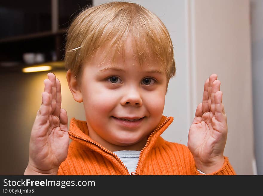 Little boy showing size of something