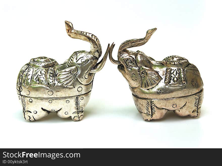 Handmade elephant silver boxes from Asia. Silver is a soft metal that has been used for many thousands of years by people all over the world, for jewelery, as money, and many other things. It is called a white metal even though it looks gray. The word silver is also used to talk about this colour or shade of gray.Silver is very malleable, and ductile, which means it can be pulled into wire or hammered into thin sheets. When it is used in money or in jewelery, it is often mixed with gold or some other metal to make it harder.