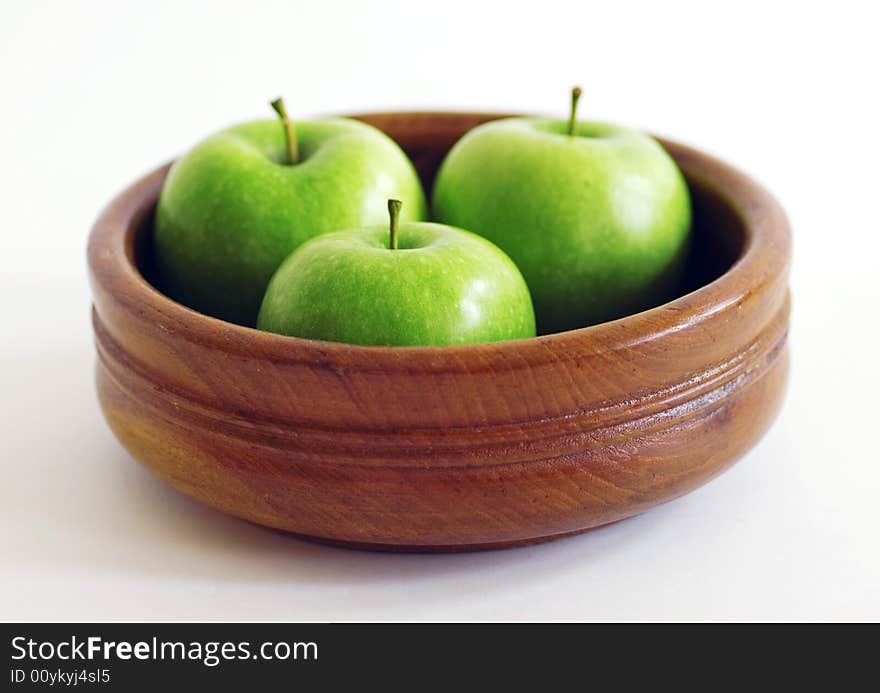 Three green apples in a bowl. Three green apples in a bowl