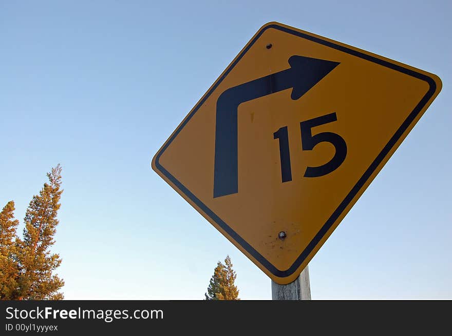 A photograph of a turn sign