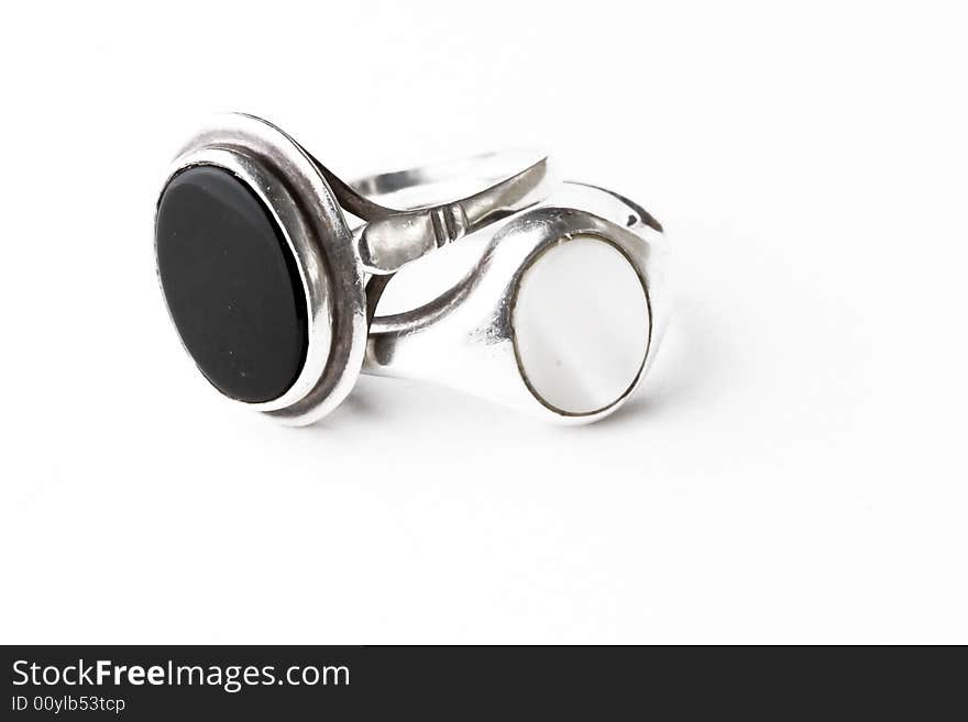 Two silver rings with precious stones isolated on white. Two silver rings with precious stones isolated on white