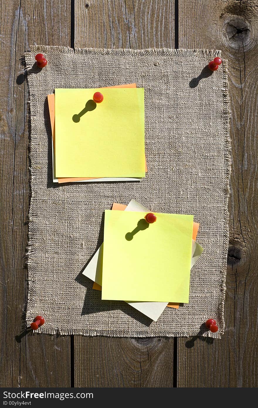 Yellow Notes On Wooden Background