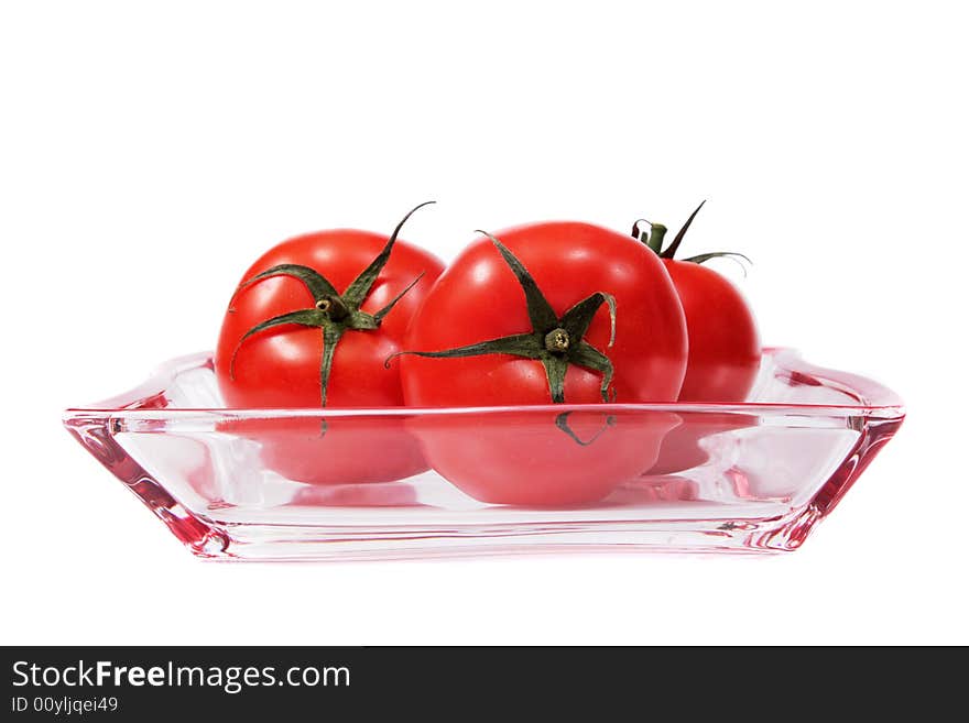 Tomatoes On A Glass Plate.