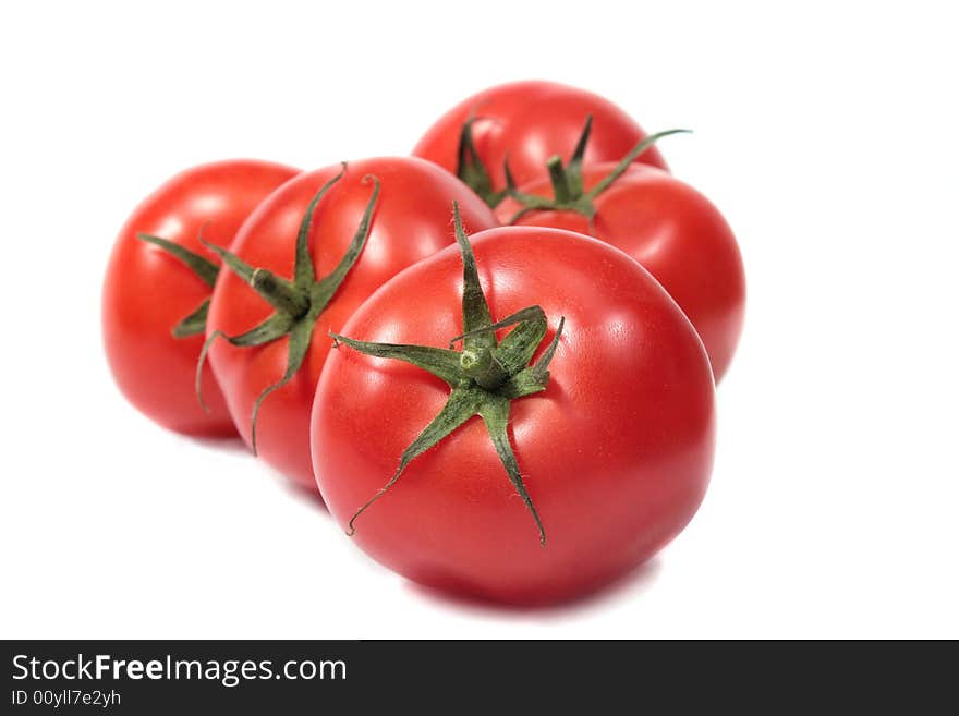 Red tomatoes isolated on white background. Red tomatoes isolated on white background.