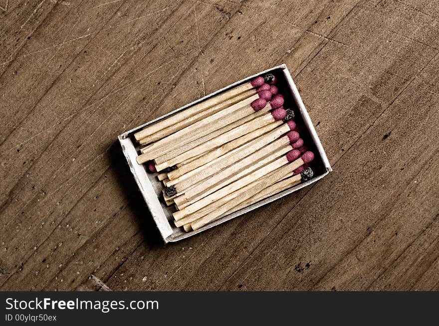 Matchbox on old table, closeup shot. Matchbox on old table, closeup shot.