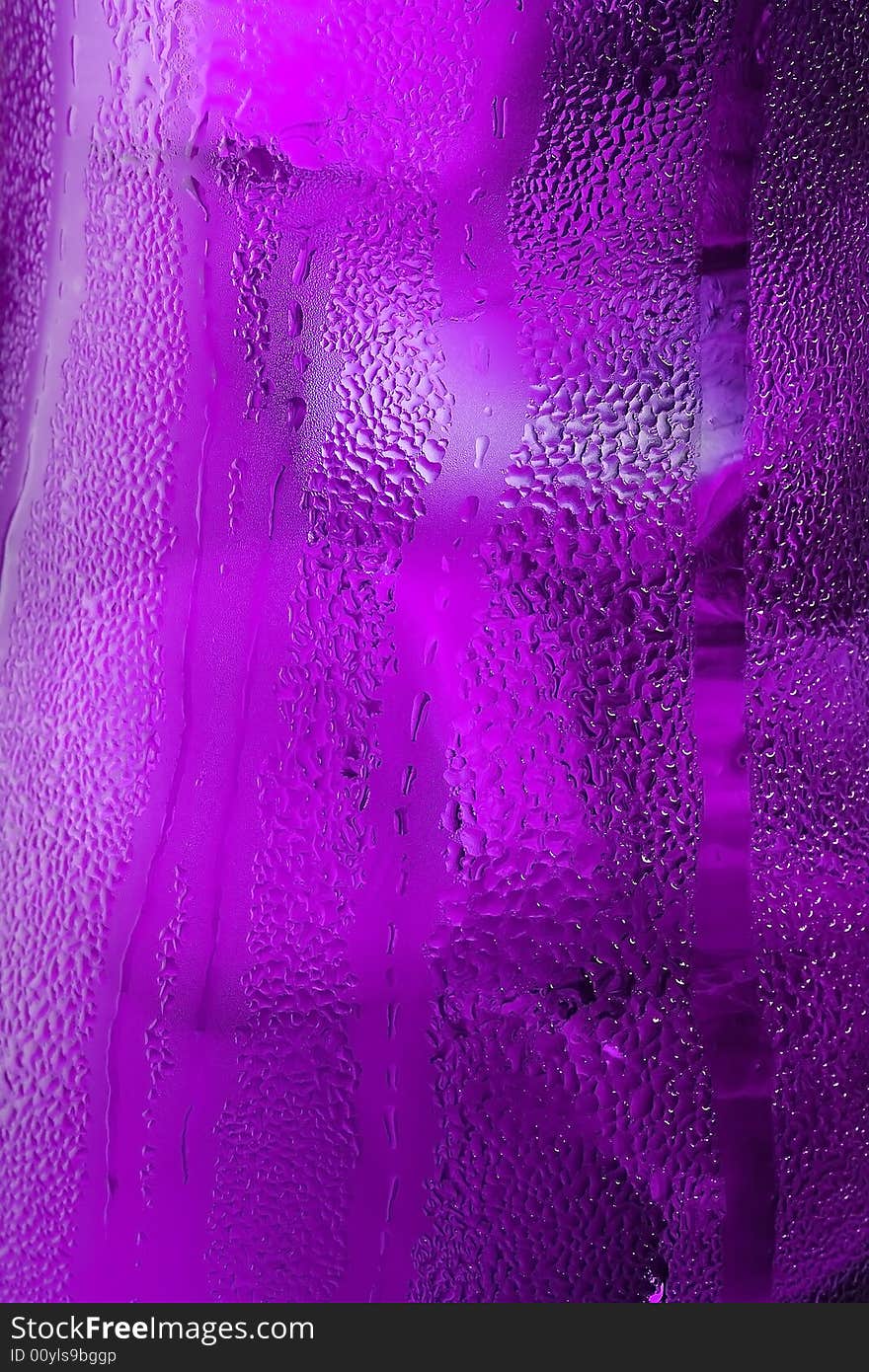 Water drops on glass with ice for background