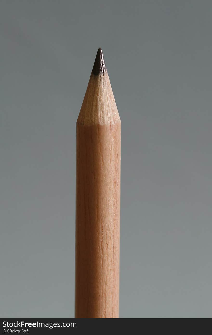 A pencil  with a simple blue color background. A pencil  with a simple blue color background