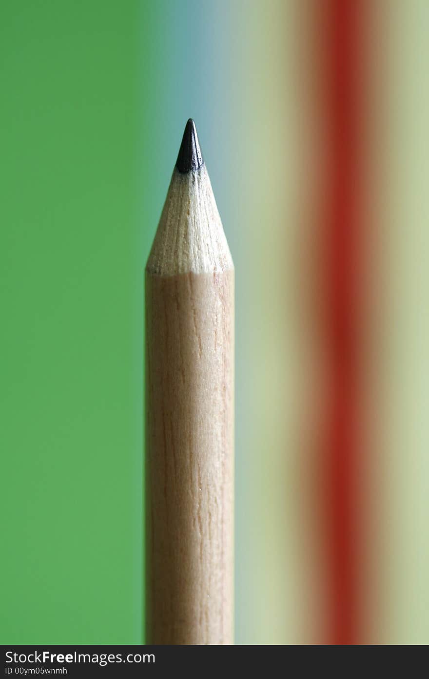 A pencil  with a simple  colorful background. A pencil  with a simple  colorful background