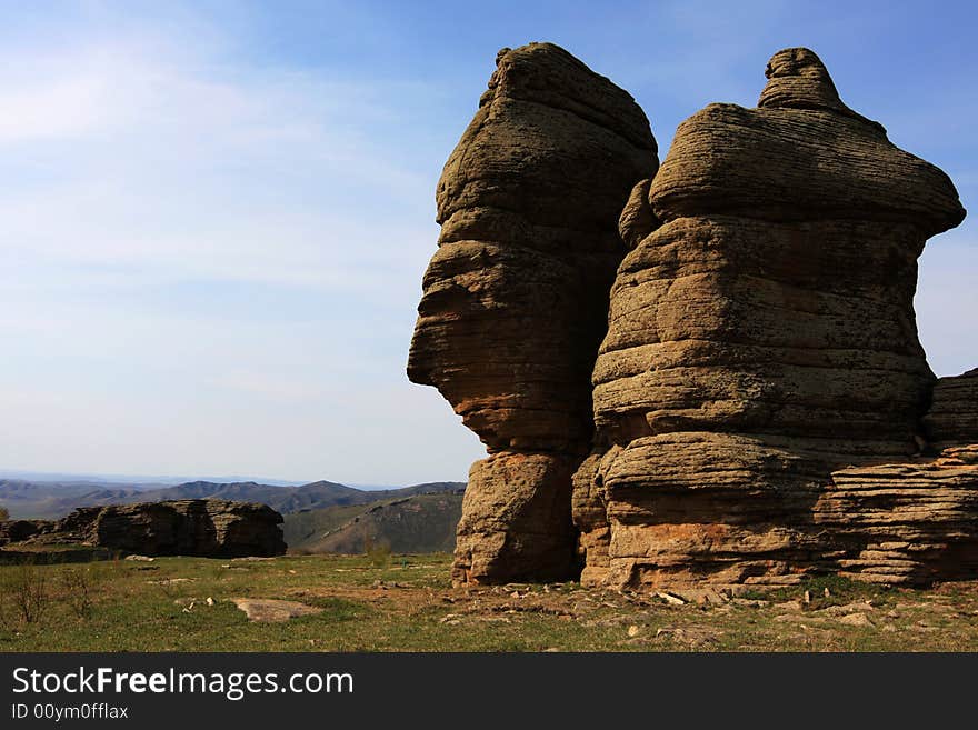 This is the stone forest in Keshiketeng Banner, inner-mongolia china. In each hill, there are many bits and pieces of stones on it. This is the stone forest in Keshiketeng Banner, inner-mongolia china. In each hill, there are many bits and pieces of stones on it.