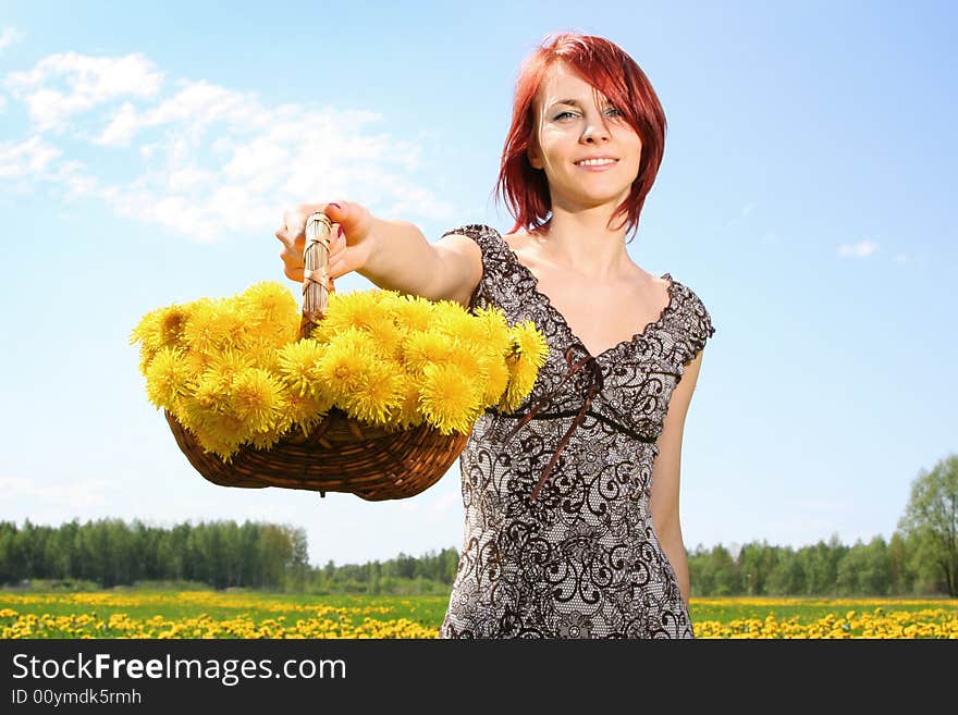 Beautiful redhead girl with dandelions. Beautiful redhead girl with dandelions