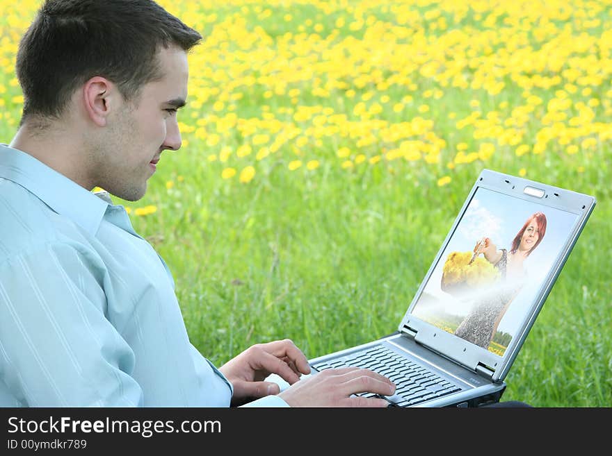 Young guy is relaxing outdoors. Young guy is relaxing outdoors