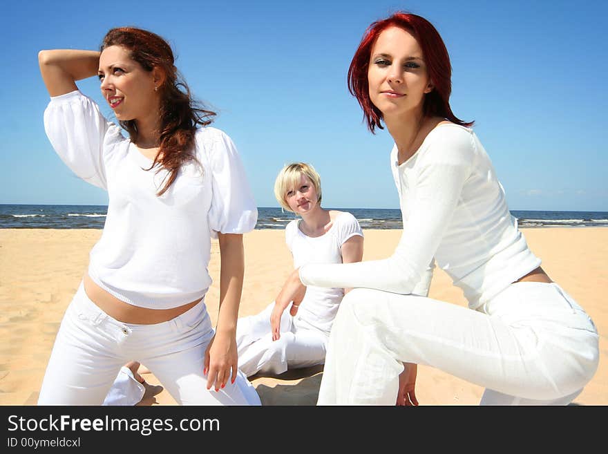 Three cute girls relaxing on the beach. Three cute girls relaxing on the beach