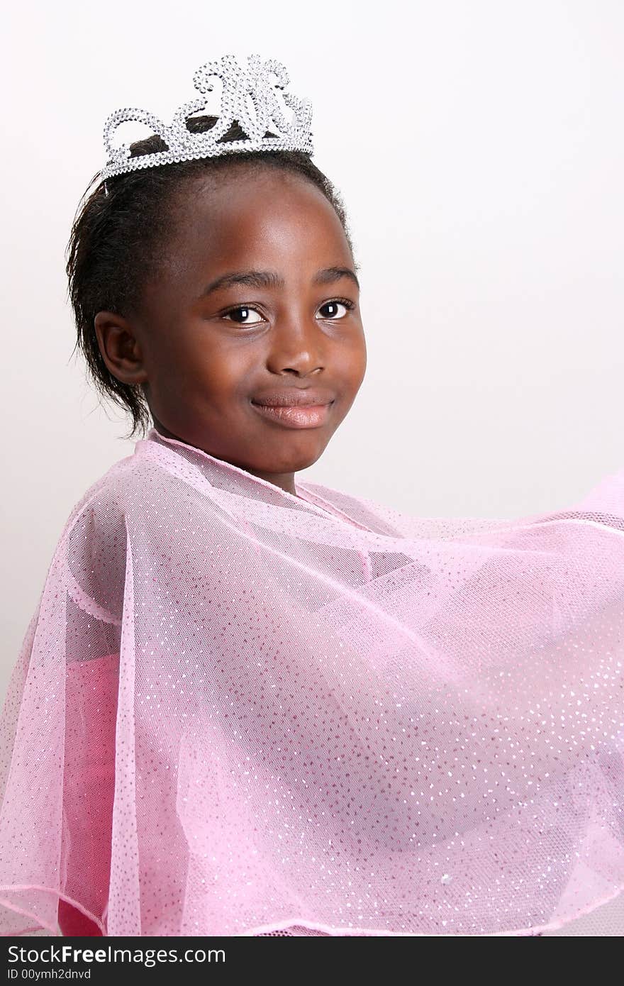 Young girl wearing a pink fairy costume with accessories