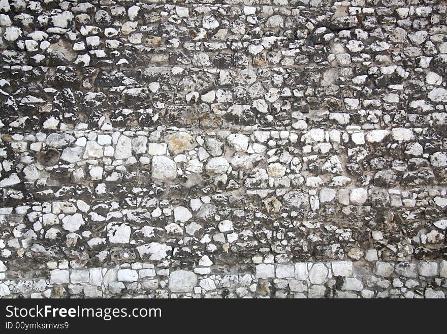 Fragment of stone wall surface