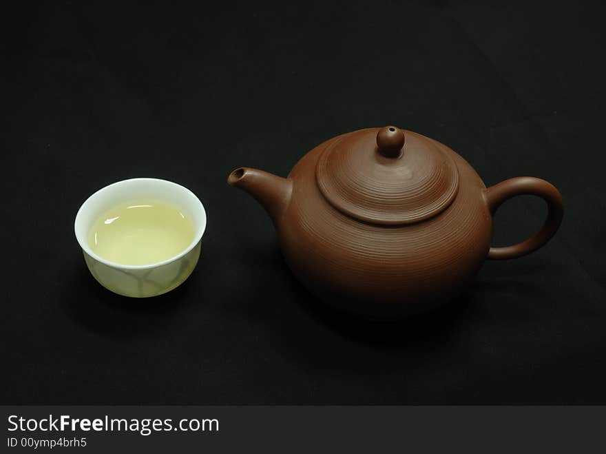 Isolated cup and teapot