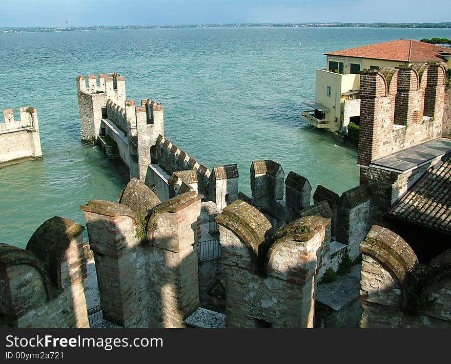 Medieval on a bank of lake, italy. Medieval on a bank of lake, italy