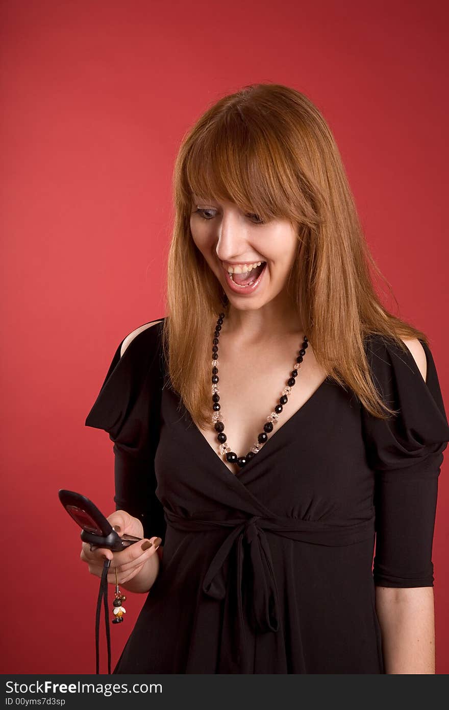 Surprised girl with mobile phone