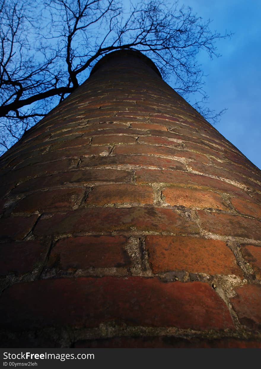 Old factory chimney reaching for the sky