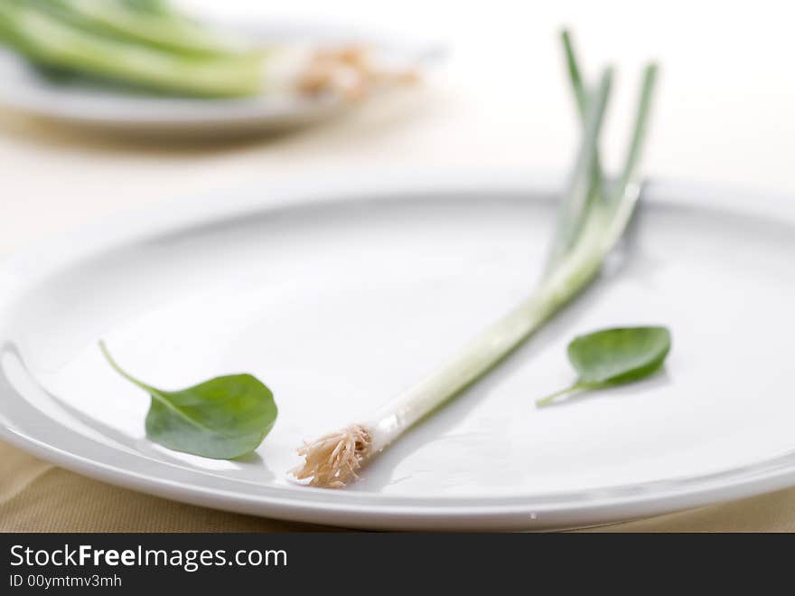 High key green onion on a plate