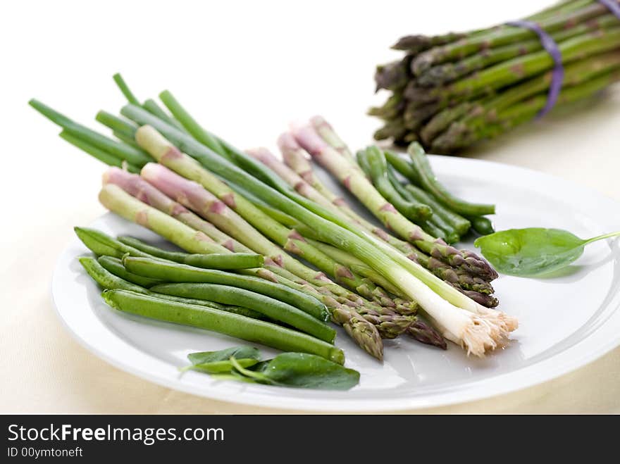 High key image of vegetables on a plate with shallow focus. High key image of vegetables on a plate with shallow focus