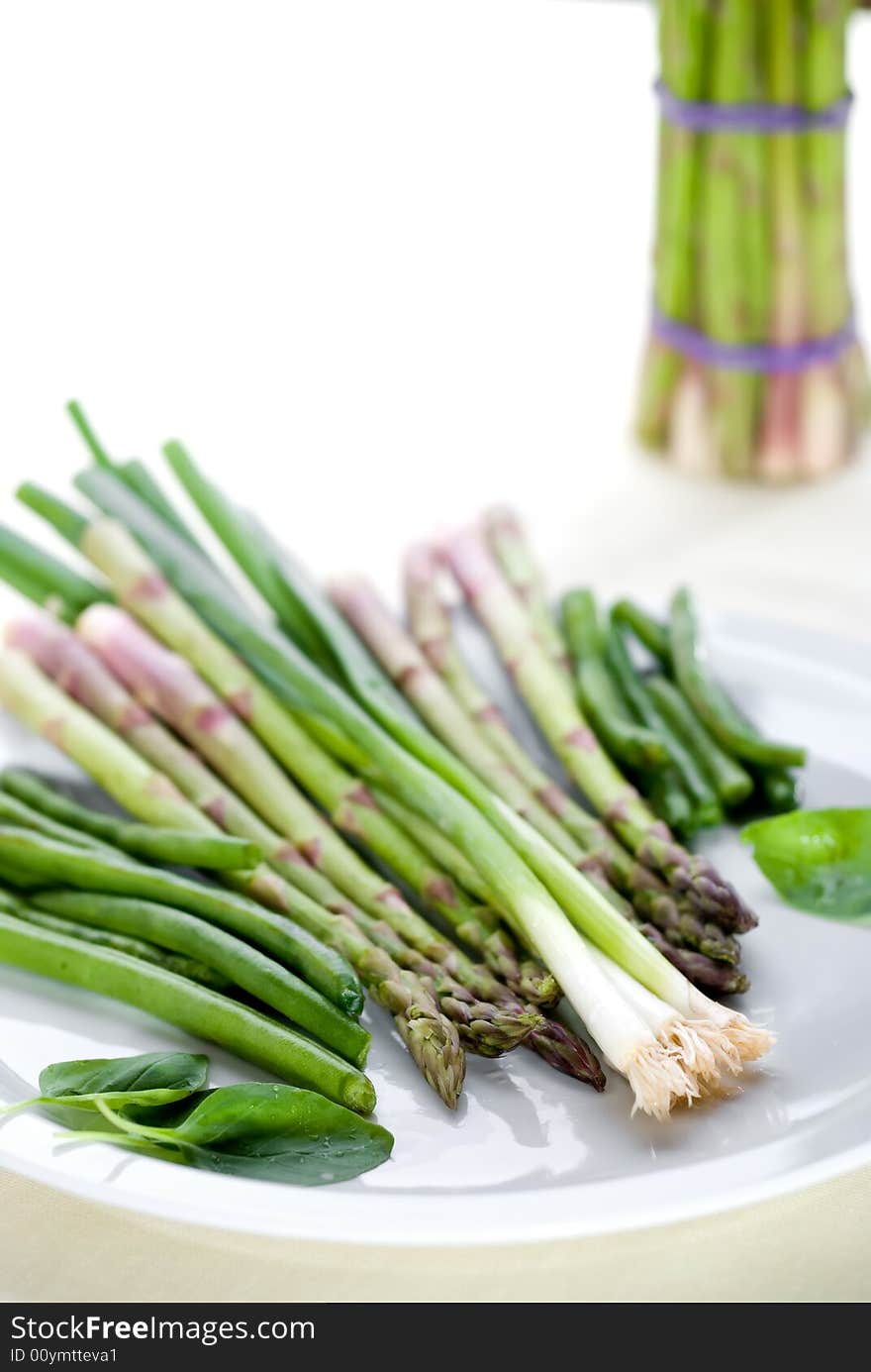 High key image of vegetables on a plate with shallow focus. High key image of vegetables on a plate with shallow focus