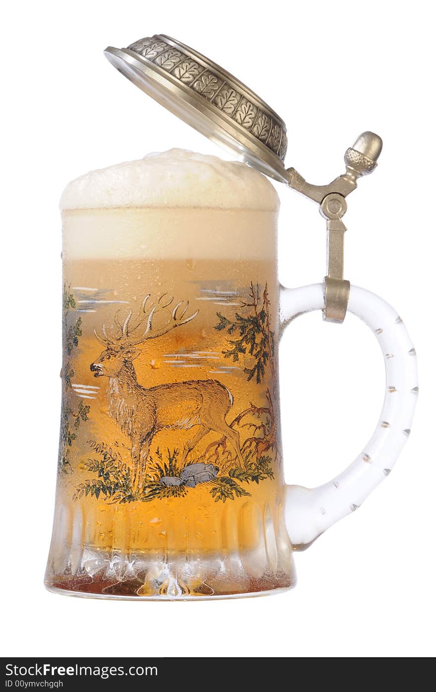 Souvenir glass with the image of the wild nature, filled by beer, with the slightly opened cover. Souvenir glass with the image of the wild nature, filled by beer, with the slightly opened cover