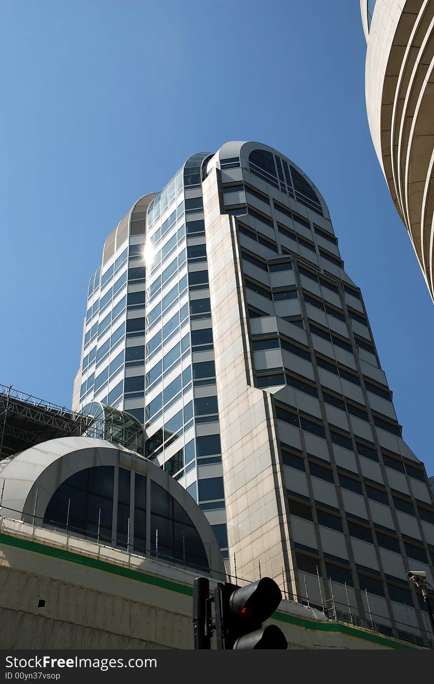 City of London tower block against a strong blue sky