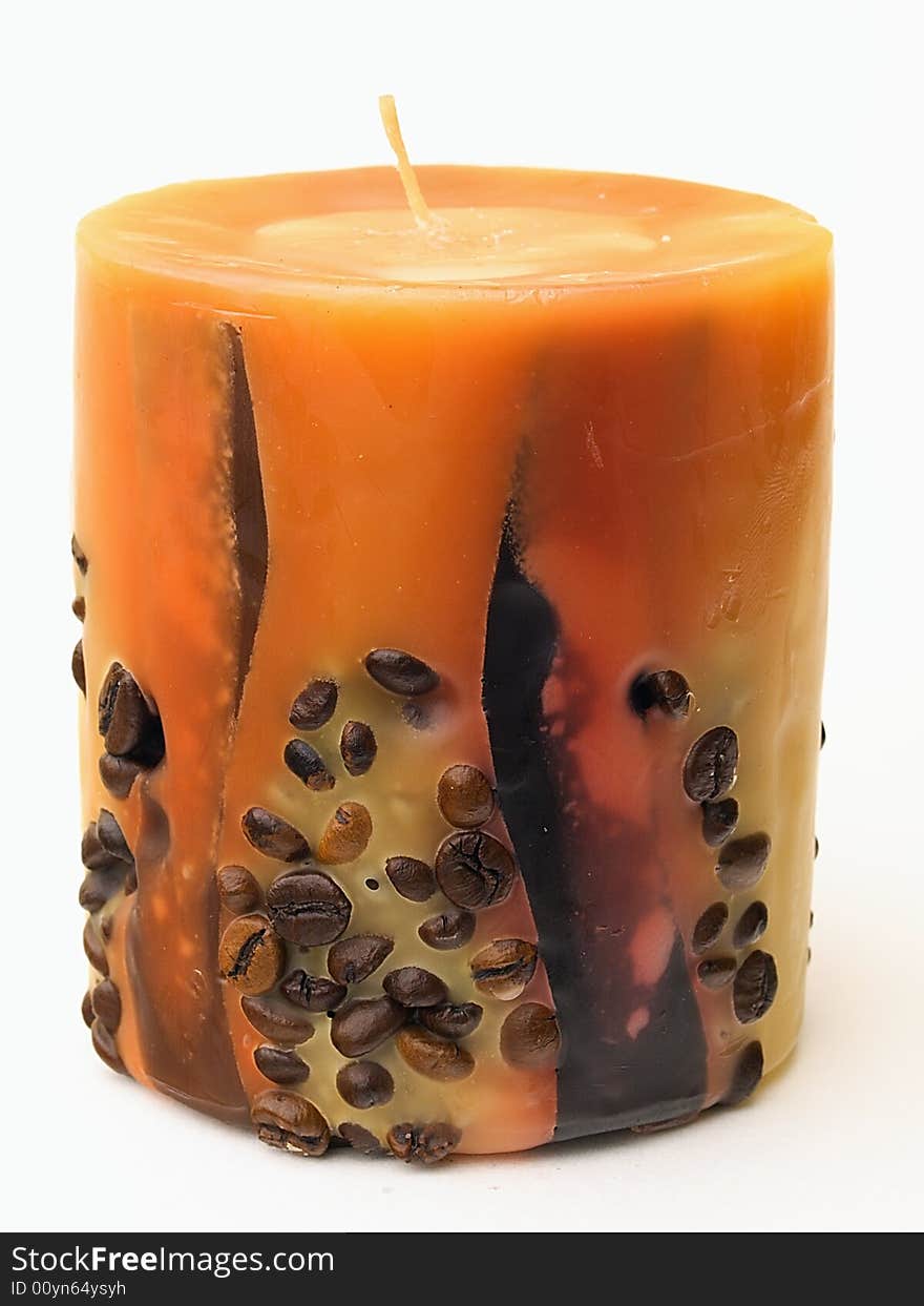 The handmade aromatic candle decorated by coffee grains. The handmade aromatic candle decorated by coffee grains