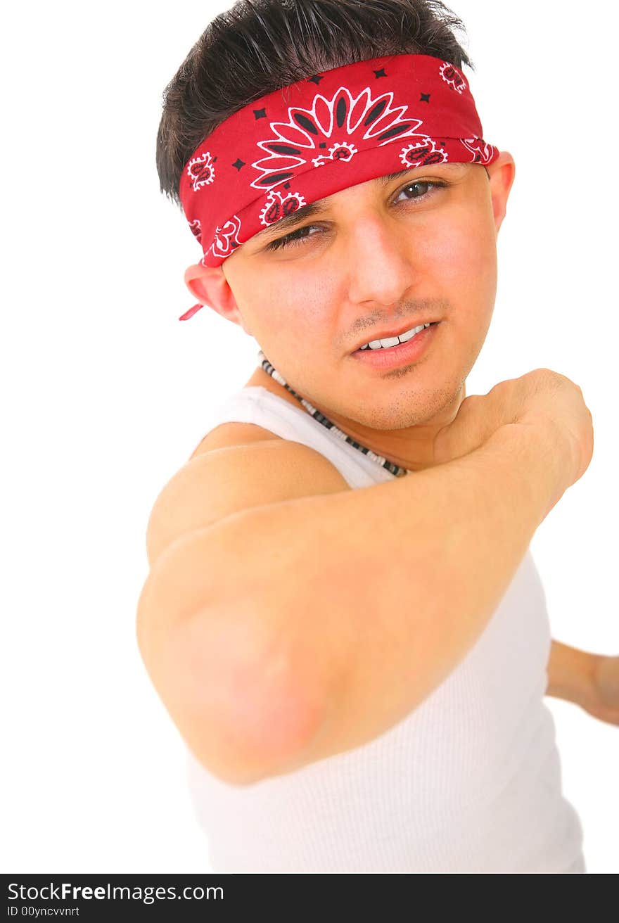 Young man wearing bandana and sleeveless undershirt pointing out his elbow. isolated on white background. Young man wearing bandana and sleeveless undershirt pointing out his elbow. isolated on white background