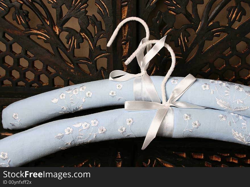 Blue Hangers on a rustic brown background