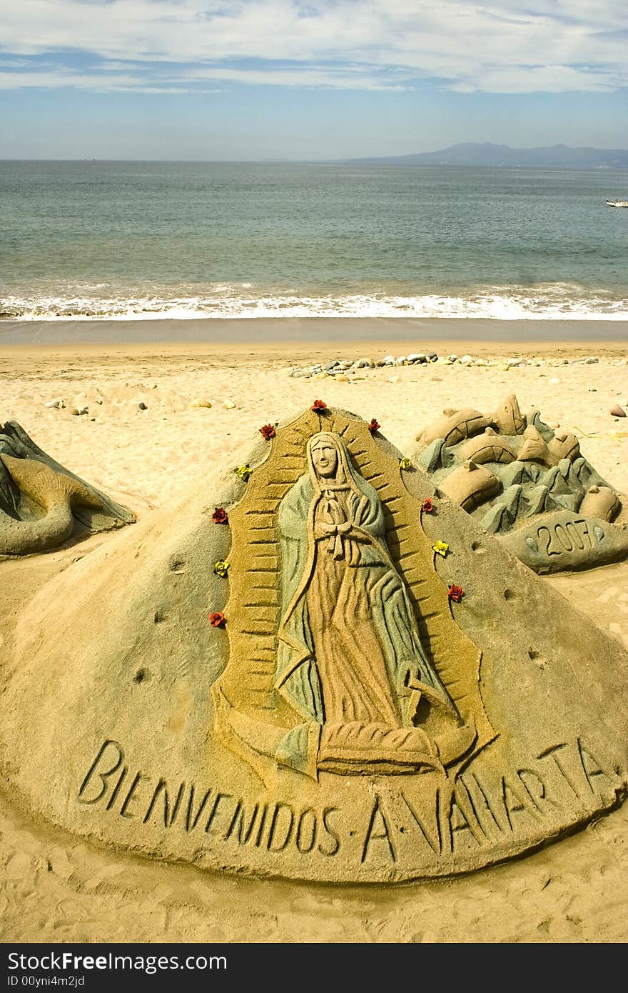 Virgen of Guadalupe sculpted in sand along the beach at Puerto Vallarta