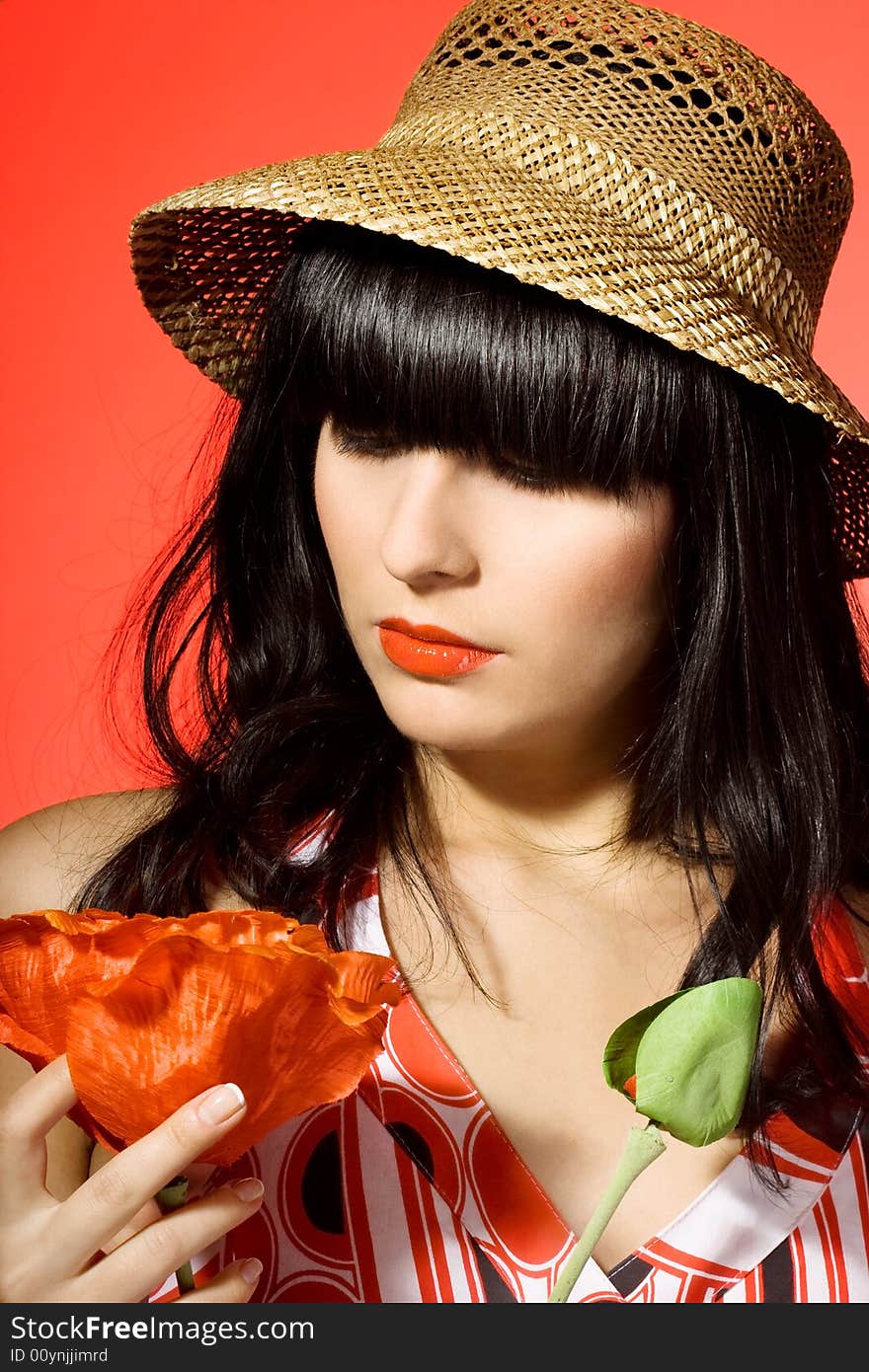 Girl in hat with flowers