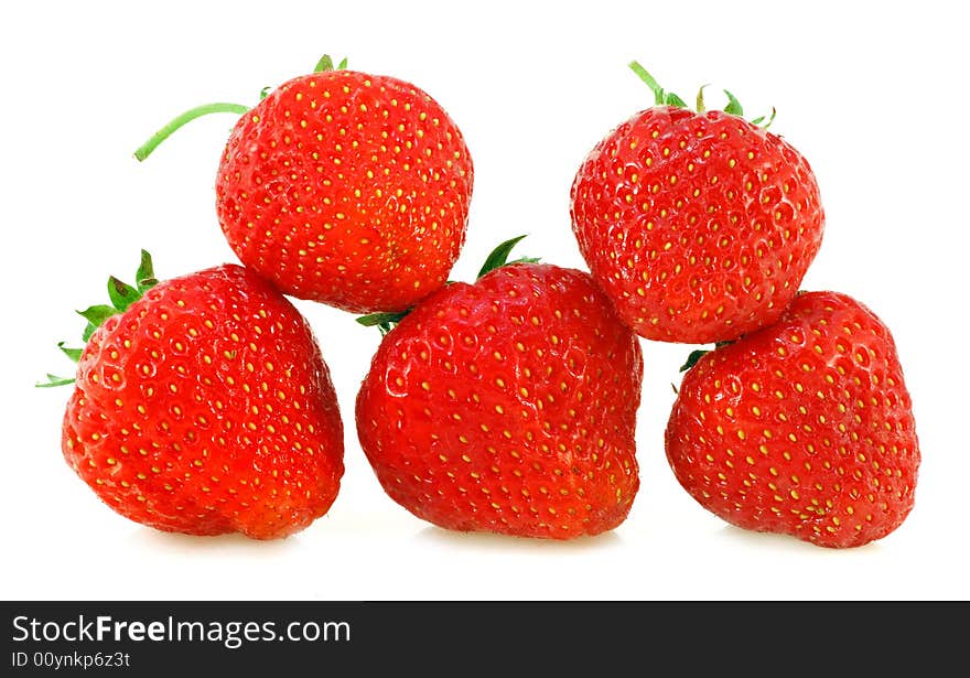 Five fresh strawberries with shadows on a white background