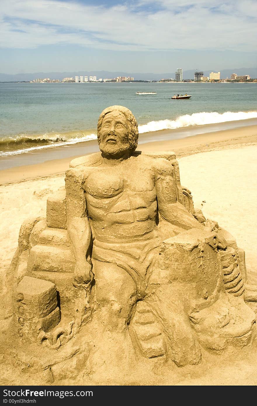 Figures sculpted in sand along the beach at Puerto Vallarta