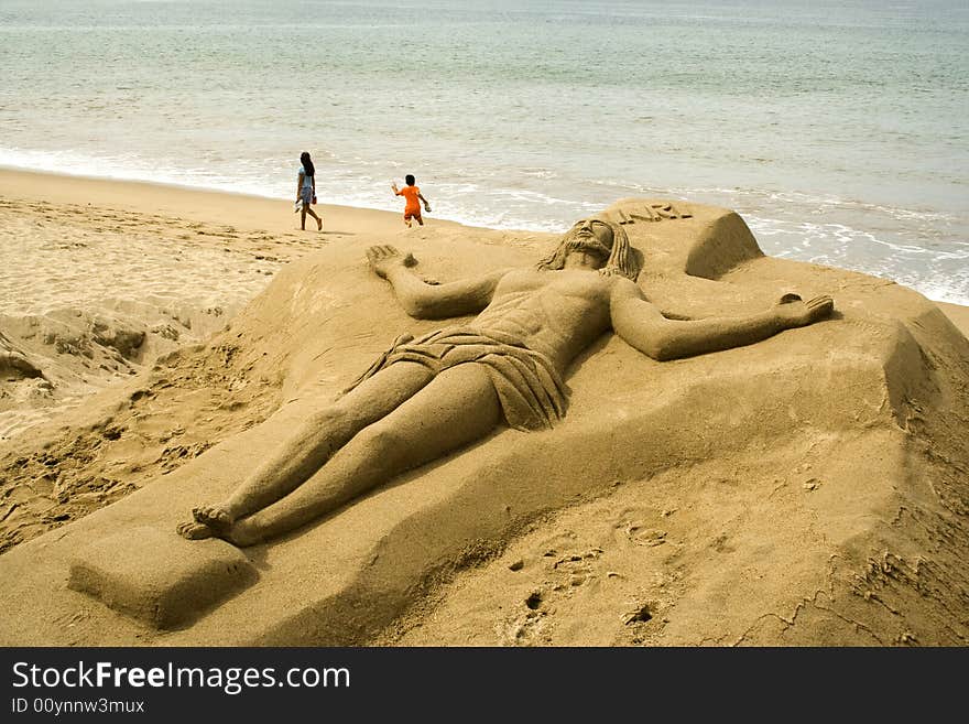 Christ sculpted in sand