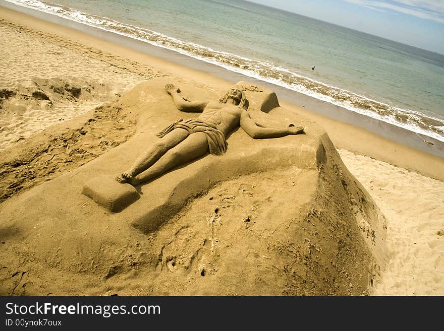 Christ Sculpted In Sand