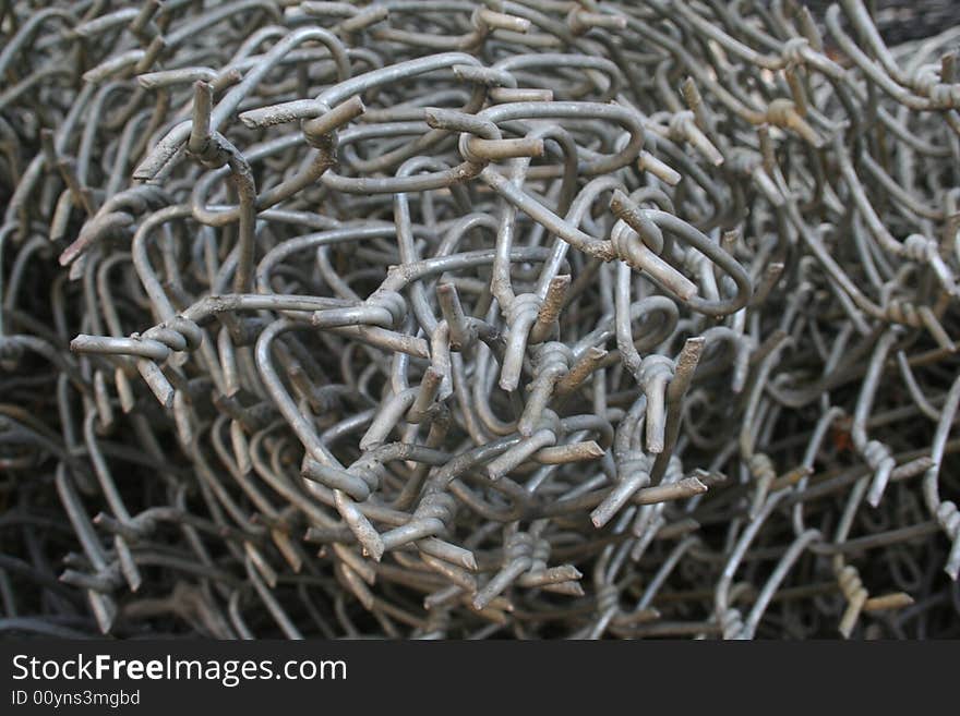 Detail of a roll of metallic chain links. Detail of a roll of metallic chain links.