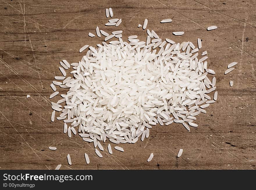 Rice on wooden table.