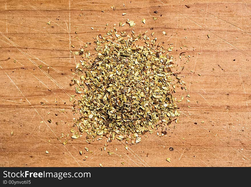 Marjoram on wooden table.