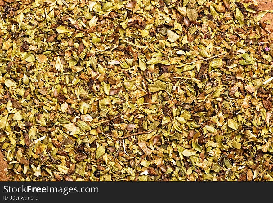 Marjoram on wooden table.