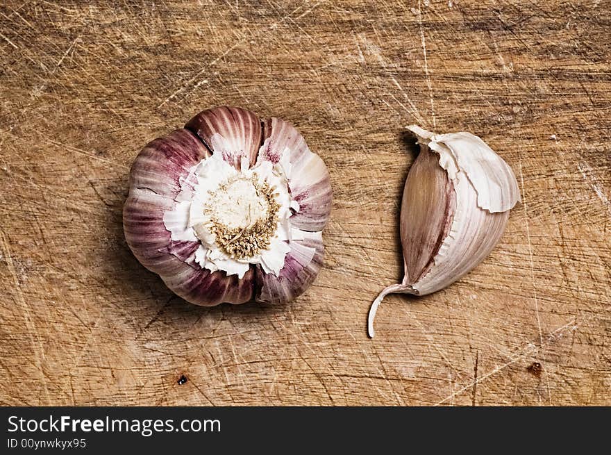 Garlic on wooden table.