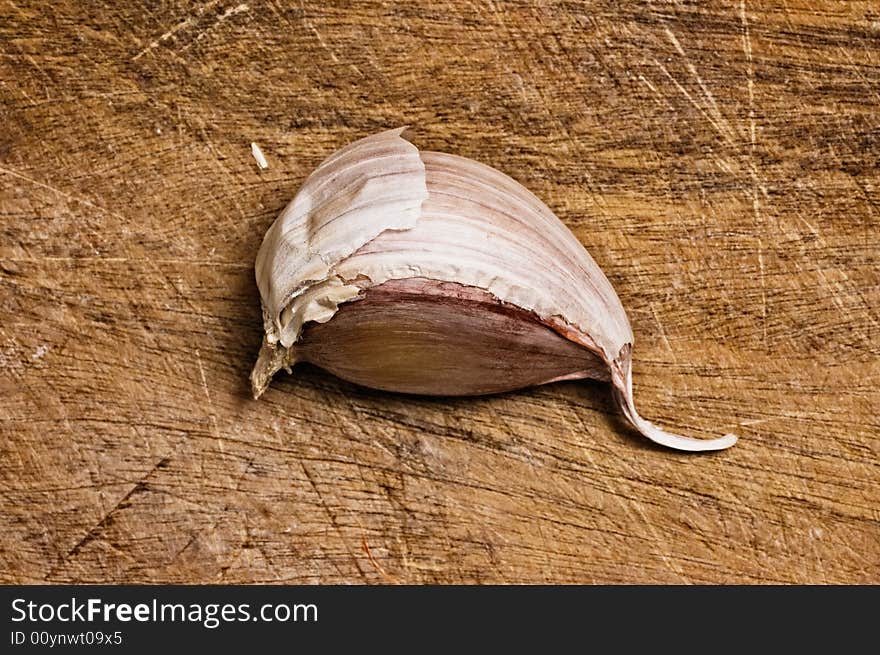 Garlic on wooden table.