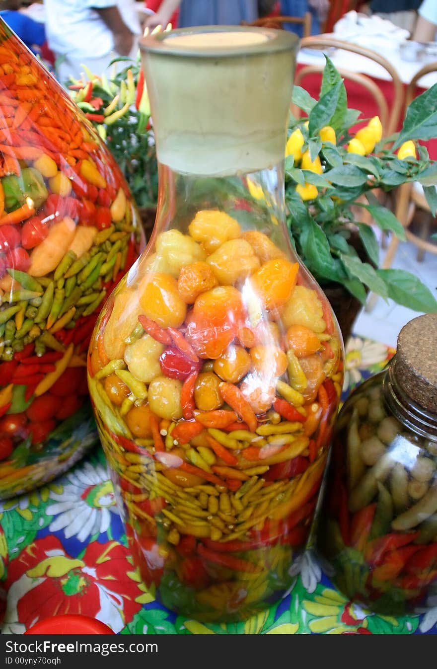 Hot peppers adorning a colourful table.