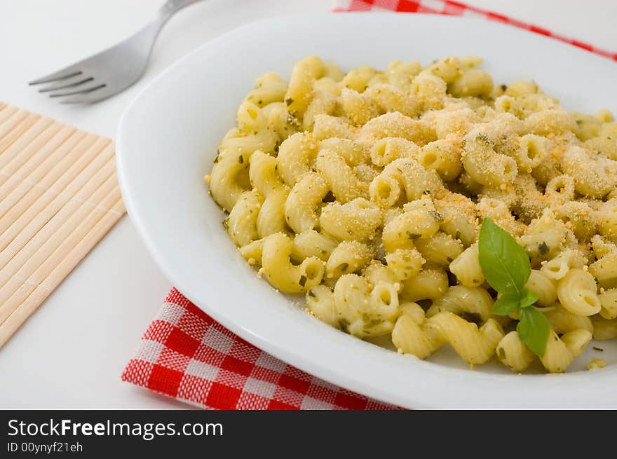 Plate of macaroni with basil